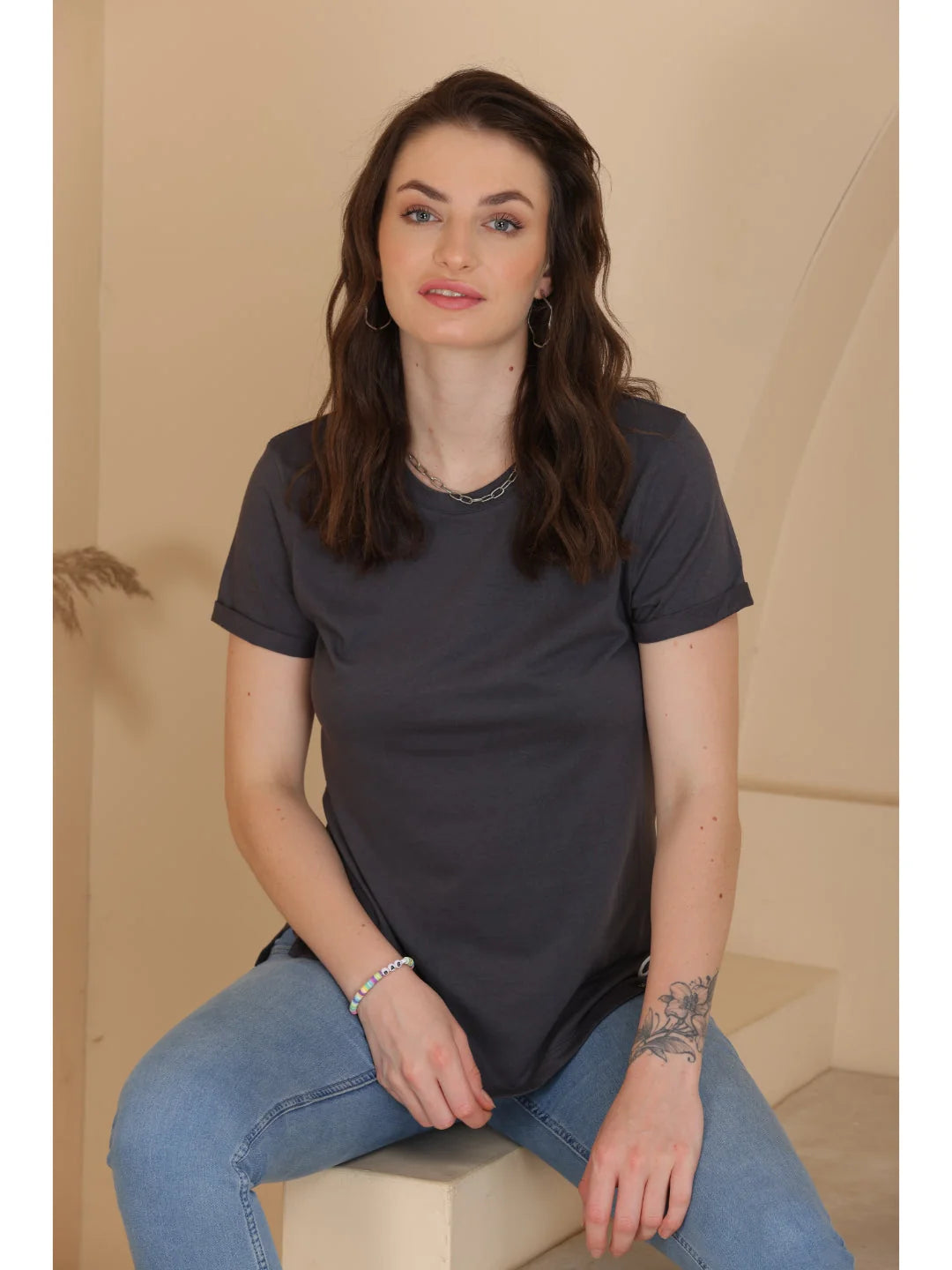 D. Gray plain t shirts for women Sitting pose 
